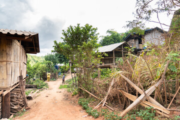 Chiang Mai, Thailand – 25 May 2021, Hill tribe Family with their home. They live in Omkoi Districk, Chiangmai Province, Thailand.