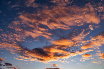 Naklejka na ściany i meble Amazing cloudscape on the sky at sunset.