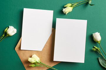 Blank invitation card mockup with envelope and flowers, front and back sides