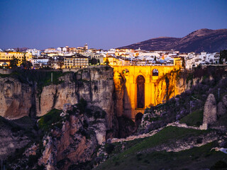 Night view of Ronda town with old bridge, Andalusia, Spain.