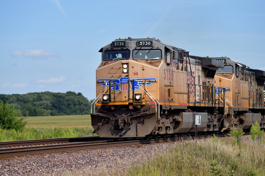 A freight train passing through farm county in northeastern Illinois.