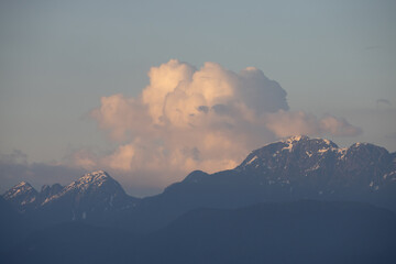 Rocky Mountain Landscape with puffy clouds during sunset. Greater Vancouver, British Columbia,...