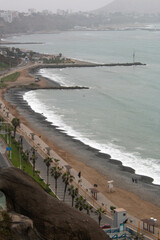 Malecon in the city of Lima, in its grey winter days, overlooking the road and the sea. Peru. 