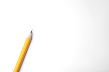 Graphite pencil on white background, top view. Space for text