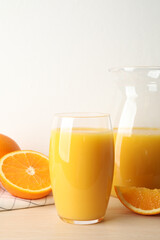 Naklejka na ściany i meble Glass of orange juice and fresh fruits on wooden table