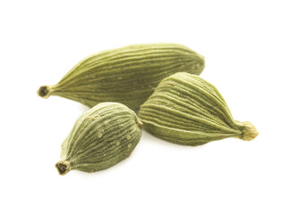 Dry green cardamom pods on white background, closeup