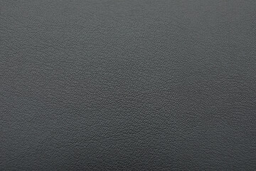 Texture of dark grey leather as background, closeup