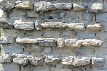 Texture of old stone wall as background, closeup