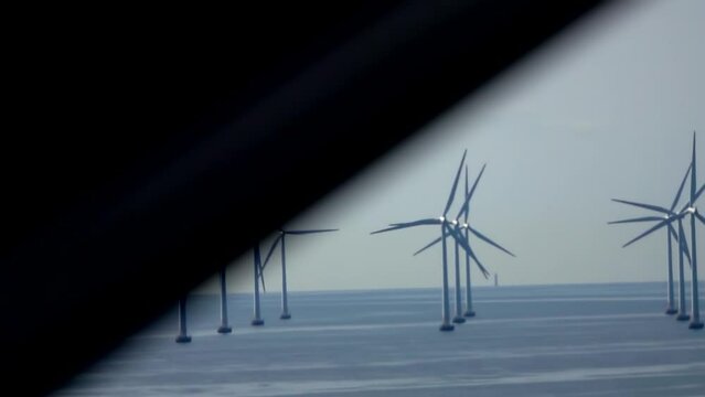 Wind turbines at sea, Copenhagen
Slow motion driving shot, Wind turbines 

