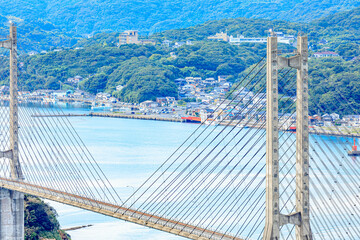 Obraz premium 夏の風の見える丘公園から見た呼子大橋 佐賀県唐津市 Yobuko Bridge from Kazeno Mieruoka Park. Saga Prefecture Karatsu city.