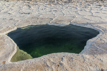 Small salty lake in the salt flats of Danakil depression, Ethiopia