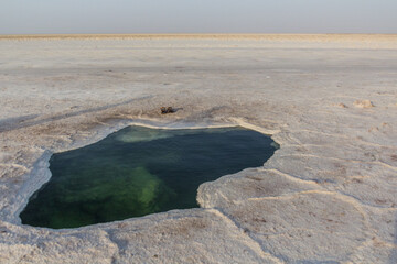 Small salty lake in the salt flats of Danakil depression, Ethiopia