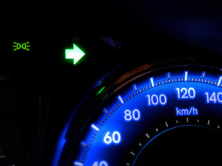 car turning signal lights on car dashboard.