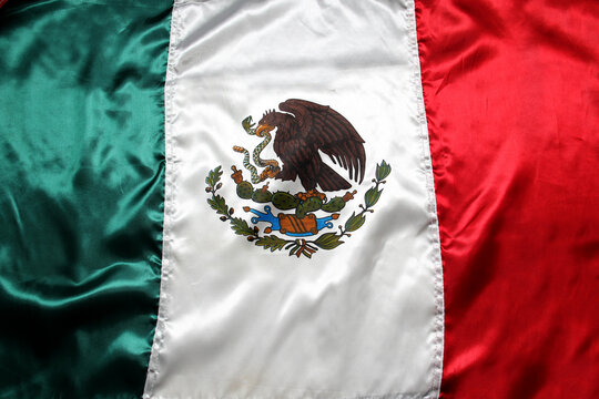 Flag of Mexico one of the Mexican national symbols with the colors green, white, red and a national shield with an eagle devouring a snake to celebrate the independence holidays on September 15 