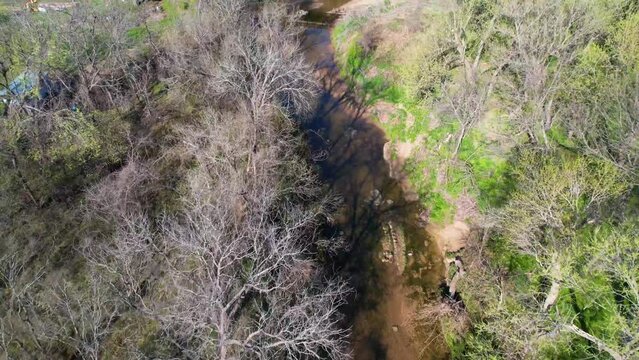 Aerial footage of Post Oak Creek in Sherman Texas. Slow flight heading straight.
