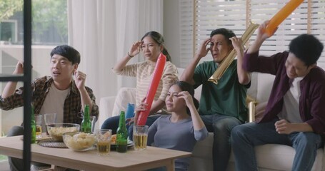 Group of asia people young adult friend man and woman scream shout excited sit at home sofa couch watch FIFA world cup game live on TV feeling upset disappointed sad anger in loss racing result. - Powered by Adobe