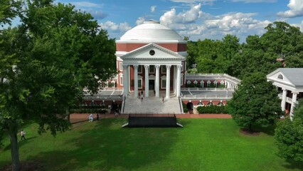 University of Virginia, UVA campus grounds. Rising aerial reveal of Rotunda on summer day. - Powered by Adobe