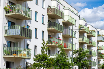 White residential building with many balconies seen in Berlin, Germany
