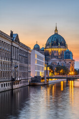 Fototapeta na wymiar View along the River Spree in Berlin at dusk with the Cathedral in the back