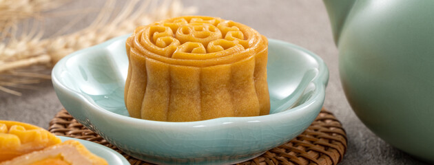 Delicious Cantonese moon cake for Mid-Autumn Festival food mooncake on gray table background.