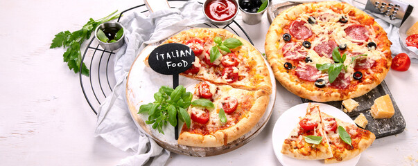 Freshly baked pizza on dark background.