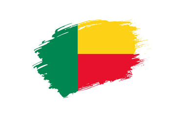 Creative hand drawn grunge brushed flag of Benin with solid background