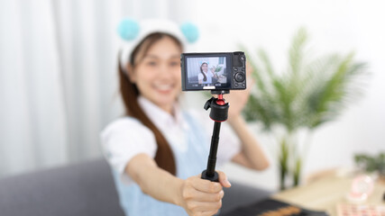 Beautiful woman with a social media influence is greeting the audience for recording vlog video live streaming, Showing how to make up and use cosmetics, Online business on concept of beauty bloggers.