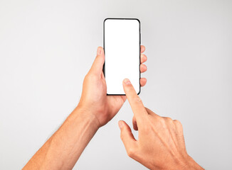 Forefinger clicking ok at phone mockup. Woman holding template with blank display in vertical position. Empty space for adding content