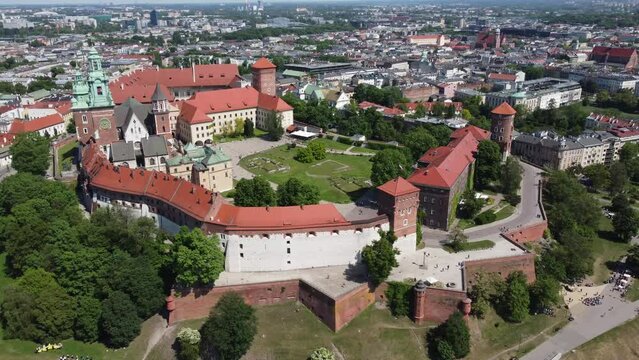 Flyover of the Wawel Royal Castle Cathedral on the Vistula (Wisła) River - Krakow, Poland, a Polish cultural capital, medieval and renaissance architecture, city center - 4K 30FPS Tracking Right