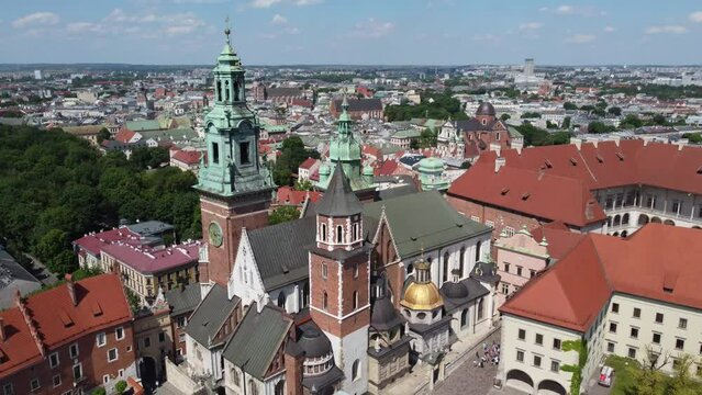 Flyover of the Wawel Royal Castle Cathedral on the Vistula (Wisła) River - Krakow, Poland, a Polish cultural capital, medieval and renaissance architecture, city center - 4K 30FPS Tracking Left