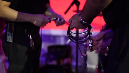 two men connected the sound system