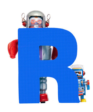 capital letter R held by vintage robot toys transparent