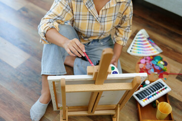 Portrait of an Asian woman designing art in her spare time.