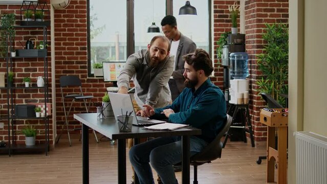 Timelapse of business people working on laptop in company office, doing collaboration with data report at accelerated speed. Colleagues doing teamwork partnership in quick motion.