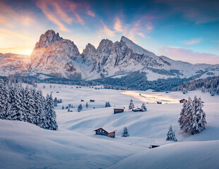 Untouched winter landscape. Frosty winter view of Alpe di Siusi village with Plattkofel peak on background. Amazing morning scene of Dolomite Alps, Ityaly, Europe. Traveling concept background..