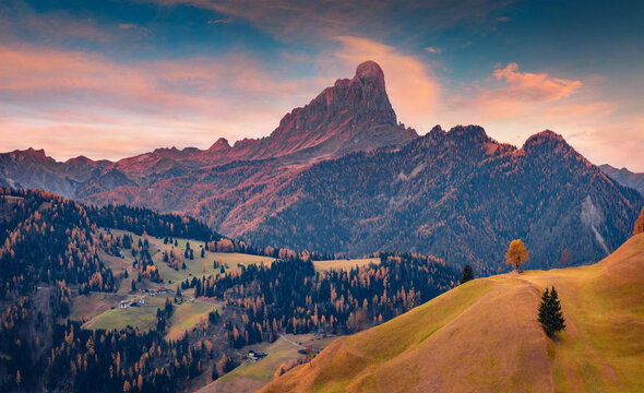 Majestic sunrise on Sas dles Diesc mountain peak. Nice autumn view of Tolpei village, Province of Bolzano - South Tyrol, Italy, Europe. Beauty of countryside concept background.