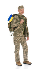 Ukraine army soldier isolated on white background. Full length portrait of old defende with backpack and Ukrainian flag. Stand for Ukraine.