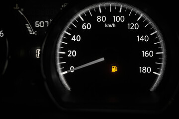 The car dashboard with a speedometer