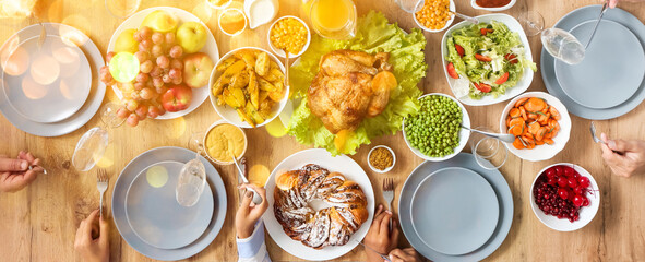 Obraz na płótnie Canvas Family having tasty Thanksgiving dinner at table, top view