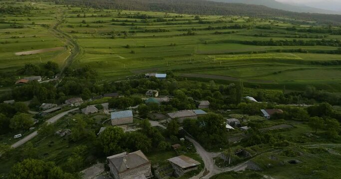 Scenic View Of Chobareti Village With Field Terraces At Background In Georgia. Aerial Pan Left