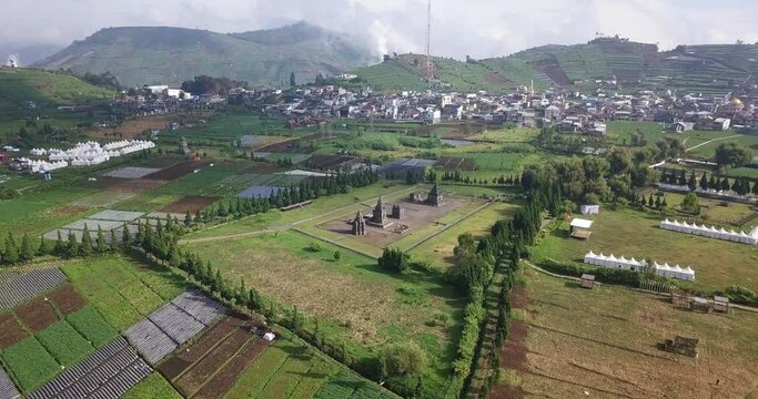 aerial drone shot of the Arjuna temple complex located in the Dieng plateau, Wonosobo district, Central Java, Indonesia.