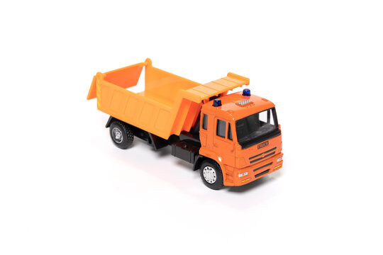 Model Of Toy Dumper Truck Isolated On White.