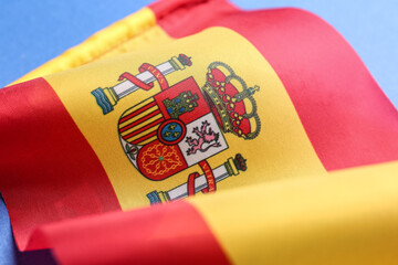 Flag of Spain on blue background, closeup