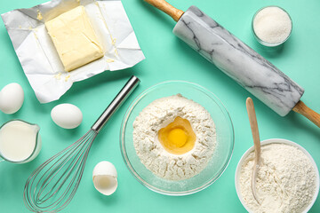 Set of ingredients and utensils for baking on color background