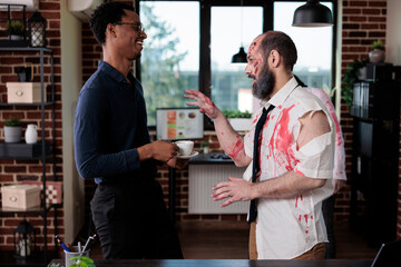 Spooky zombie talking to person in office, bloodthirsty brain eating monster having conversation in...