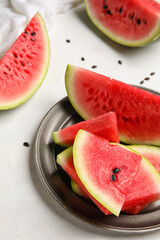 Plate with slices of watermelon on white background, closeup