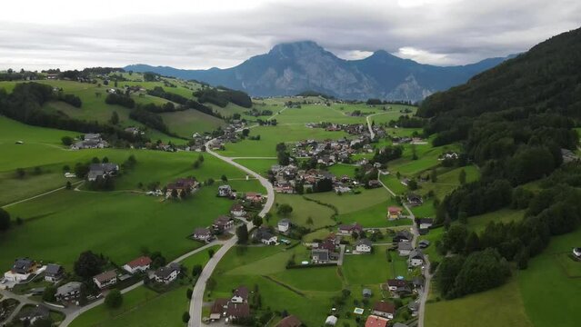 Flight over of Traunkirchen church on Traunsee lake, in Salzkammergut, Upper Austria.