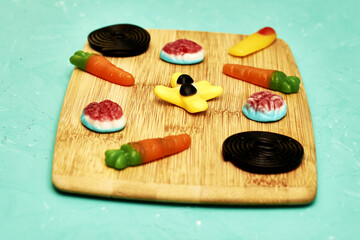 children's marmalade in the form of funny figures on a cutting board