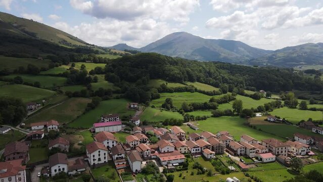 Tilt up aerial shot revealing the cozy village of Amaiur-Maya, municipality of Baztan Valley (Navarra, Spain)