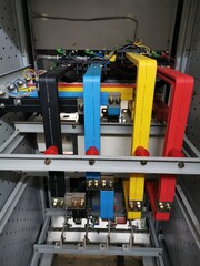 Image of copper busbar connection in electrical cabinet. Selective focus.